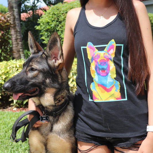 Woman wearing Neon Art German Shepherd racerback tank top with her German Shepherd dog