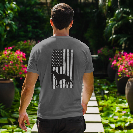 Man wearing gray American flag German Shepherd t-shirt, back print view outdoors