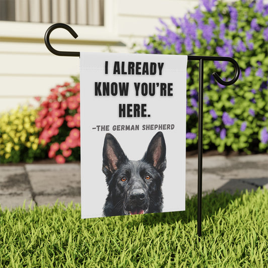 Black German Shepherd garden banner with “I Already Know You’re Here” design featuring a Black German Shepherd on a green grass background.