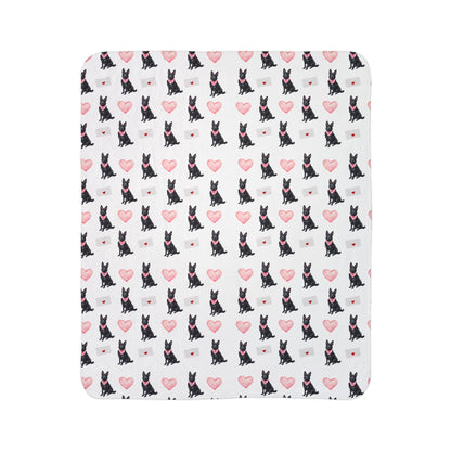 Close-up of black German Shepherd Valentine's blanket pattern with pink hearts and love letters