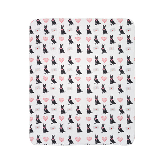 Close-up of black German Shepherd Valentine's blanket pattern with pink hearts and love letters