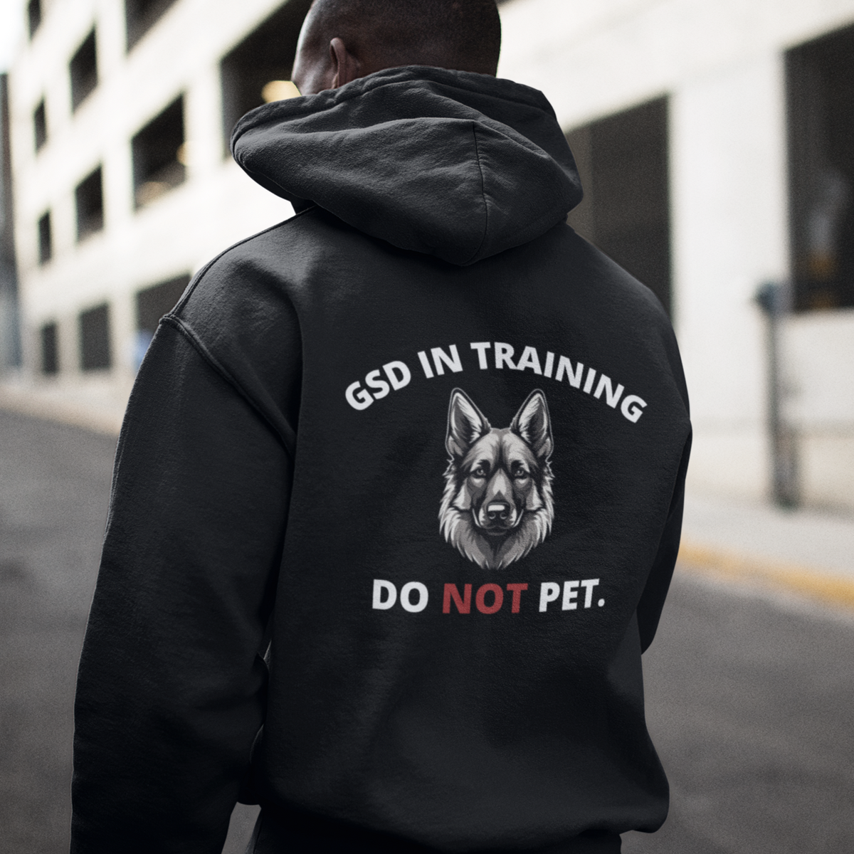 Model wearing unisex Dog In Training Do Not Pet German Shepherd hoodie