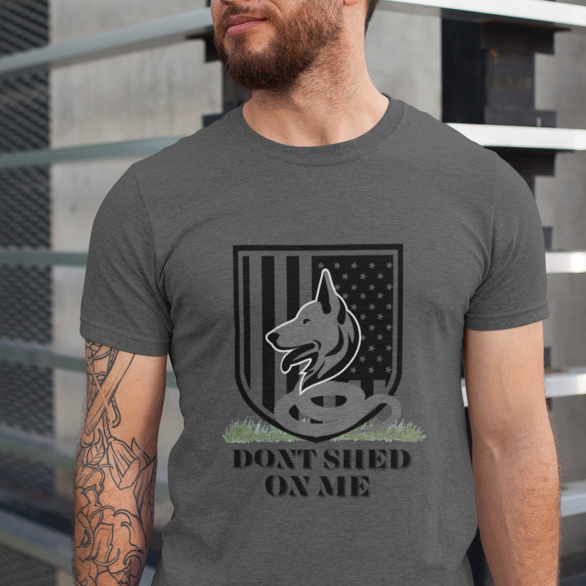 Man wearing gray Don't Shed On Me funny German Shepherd t-shirt with flag shield design