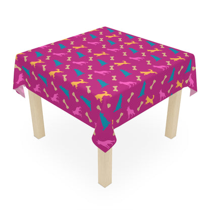Pink German Shepherd birthday tablecloth on party table, white background