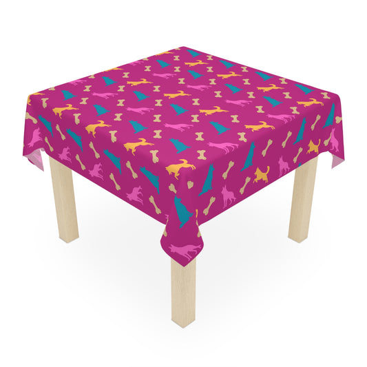 Pink German Shepherd birthday tablecloth on party table, white background