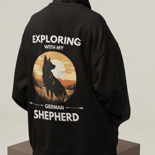 Man wearing German Shepherd Explore hoodie with outdoor adventure design