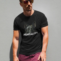 Man wearing black German Shepherd Mentality t-shirt with dark dog graphic, front view