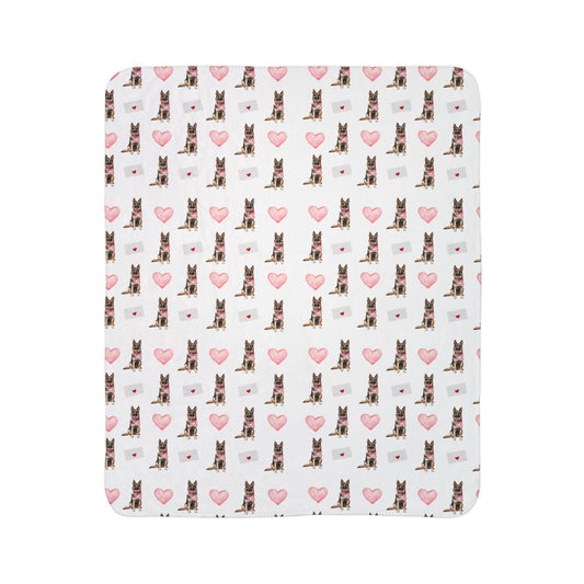 Close-up of German Shepherd Valentine's blanket pattern with pink hearts and love letters