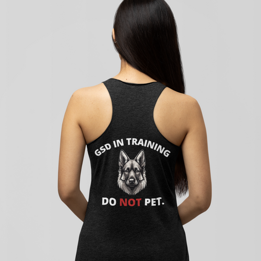 Woman wearing black GSD In Training Do Not Pet German Shepherd racerback tank top, back view