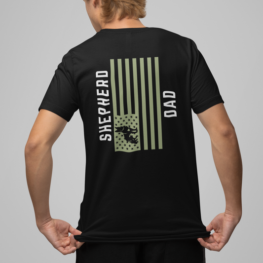 Man wearing black Shepherd Dad t-shirt, back print with olive American flag and German Shepherd