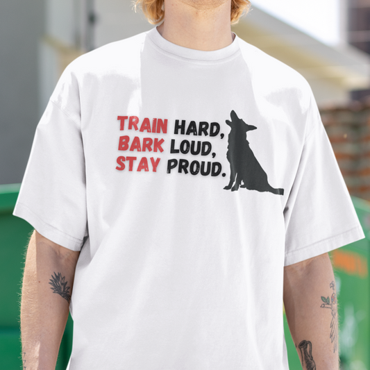 Man wearing white Train Hard Bark Loud Stay Proud German Shepherd t-shirt, front view