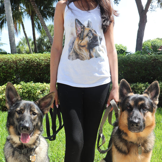 Woman wearing white Watercolor German Shepherd tank top outdoors with her two German Shepherds