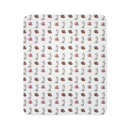 Close-up of white German Shepherd football blanket pattern with footballs and helmets