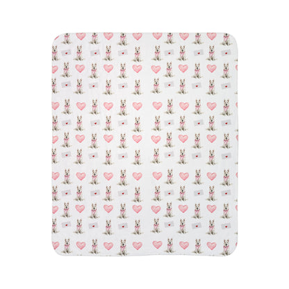 Close-up of white German Shepherd Valentine's blanket pattern with pink hearts and love letters