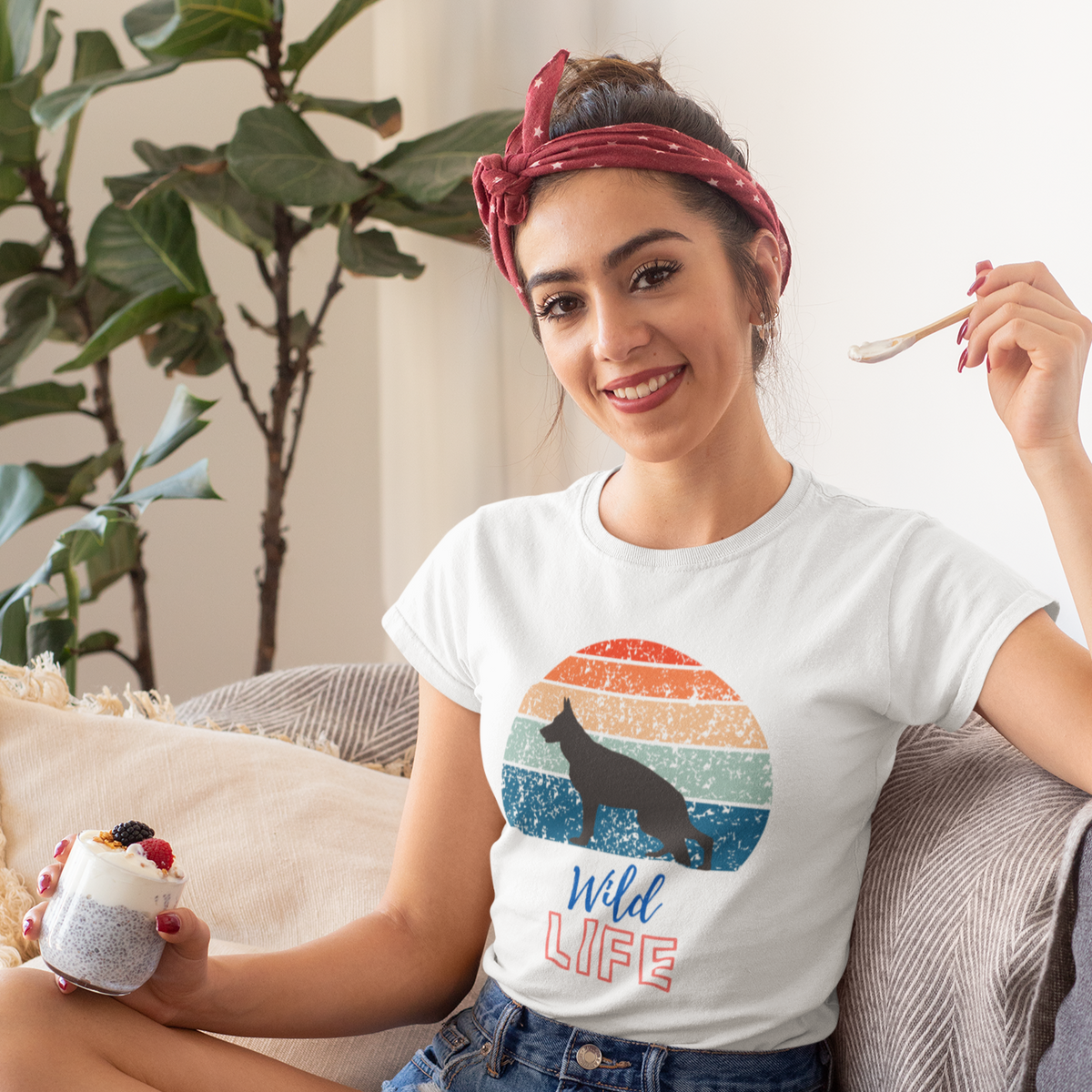 Woman wearing white Retro Wild German Shepherd t-shirt with vintage sunset design