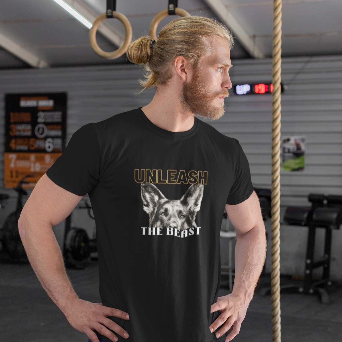 Man wearing Unleash the Beast German Shepherd t-shirt in the gym, workout apparel