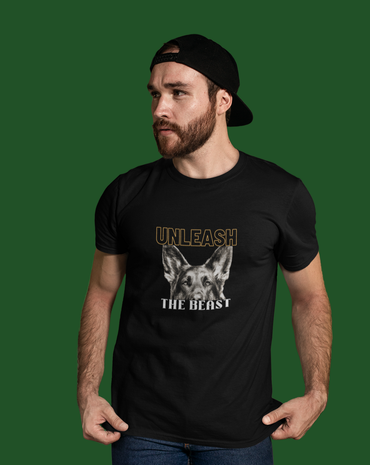 Man wearing black Unleash the Beast German Shepherd t-shirt, front view on green background