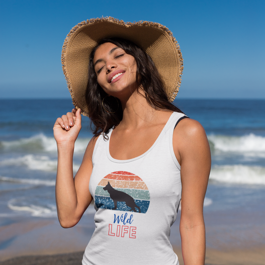 Woman in sun hat wearing white Wild Life Retro German Shepherd tank top at the beach